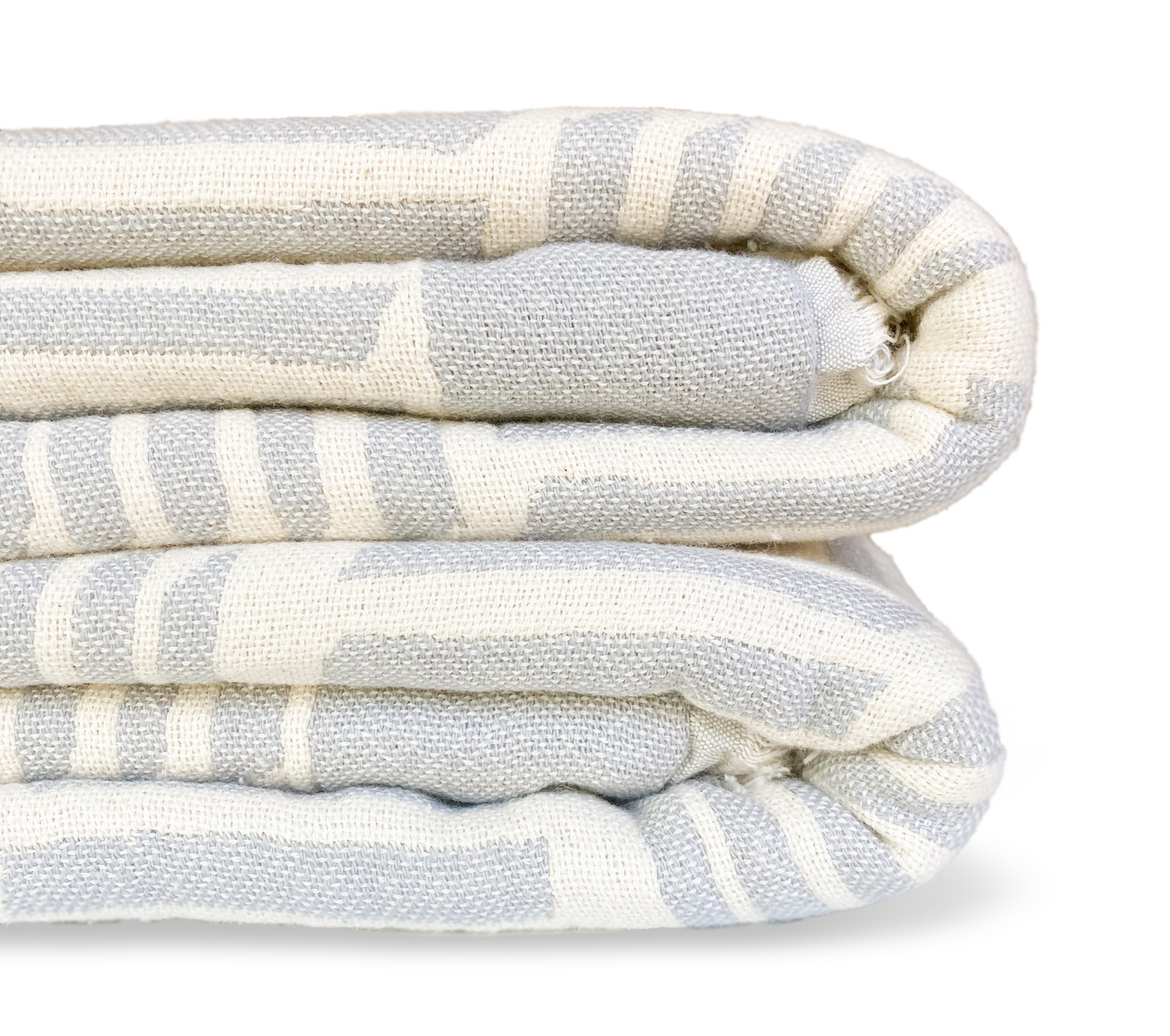 gray and ivory blanket with a modern geometric pattern folded up